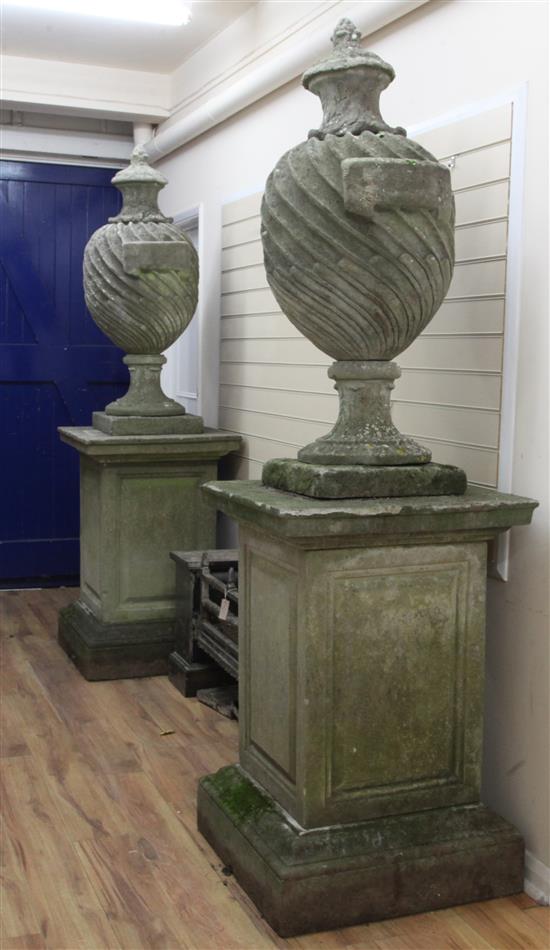 A large pair of reconstituted stone popes urns, overall H.7ft 3in.